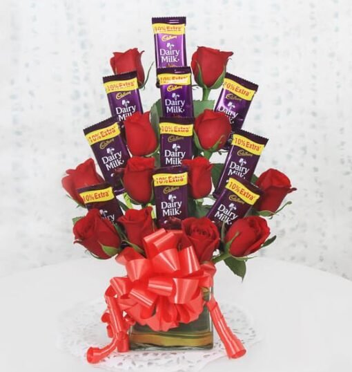 Beautiful arrangement of red roses paired with luxurious chocolates, ideal for romantic occasions, anniversaries, or expressing love and appreciation.