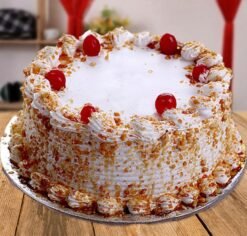 Cherry Flavored Butterscotch Cake, featuring layers of moist butterscotch infused with sweet cherries, beautifully decorated for a delightful dessert experience.