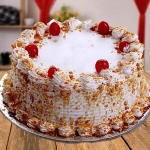 Cherry Flavored Butterscotch Cake, featuring layers of moist butterscotch infused with sweet cherries, beautifully decorated for a delightful dessert experience.