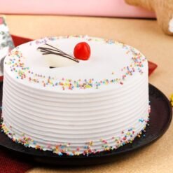 Moist and delicious Vanilla Cake, elegantly decorated, perfect for birthdays, celebrations, or any occasion that calls for a sweet treat.