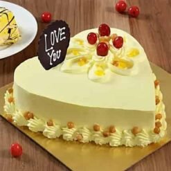 Butterscotch Heart Cake beautifully decorated with creamy butterscotch frosting, designed to celebrate love on special occasions like anniversaries or Valentine's Day.