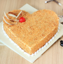 Heart Design Butterscotch Cake beautifully decorated with rich frosting, showcasing a charming heart shape, ideal for romantic occasions and special celebrations.