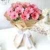 Bouquet of Pink Gerberas showcasing a vibrant arrangement of fresh pink gerbera daisies, beautifully wrapped for gifting on special occasions.