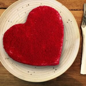 Heart Shaped Red Velvet Cake with rich red layers and smooth cream cheese frosting, perfect for romantic occasions like Valentine's Day.