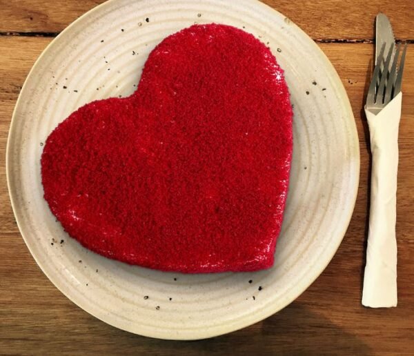 Heart Shaped Red Velvet Cake with rich red layers and smooth cream cheese frosting, perfect for romantic occasions like Valentine's Day.