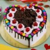 Heart Design Gems Cake featuring a beautifully decorated heart-shaped cake adorned with colorful edible gems and elegant frosting, ideal for romantic celebrations.