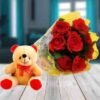 Beautiful bouquet of vibrant roses paired with a cute teddy bear, perfect for expressing love and affection on special occasions.