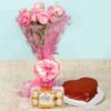 Red velvet cake paired with Ferrero Rocher chocolates and a vibrant bouquet, perfect for special occasions like anniversaries and birthdays.