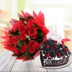 Black Forest Cake paired with a bunch of red roses, ideal for romantic occasions and celebrations.