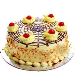 Cherries Butterscotch Cake featuring moist layers of butterscotch infused with cherries, elegantly decorated for a delicious and visually appealing dessert.