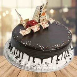 Chocolate with Vanilla Cake featuring layers of rich chocolate and smooth vanilla cream, elegantly decorated for special occasions and celebrations.