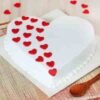 Elegant White Heart Vanilla Cake featuring fluffy vanilla layers and heart-shaped design, ideal for birthdays, anniversaries, or special romantic celebrations.