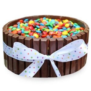 Decadent Kit Kat Gems Cake featuring layers of chocolate and crispy Kit Kat bars, topped with colorful candy gems, ideal for special occasions.