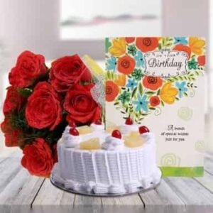 Pineapple Cake accompanied by a greeting card and a colorful bouquet, perfect for celebrations, birthdays, and special occasions.