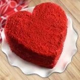 Heart Designer Red Velvet Cake featuring rich red velvet layers and cream cheese frosting, ideal for romantic occasions and celebrations.