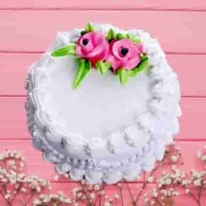 Rose Vanilla Cake with light vanilla layers infused with rose flavor, beautifully decorated with rose accents, ideal for special occasions and celebrations.