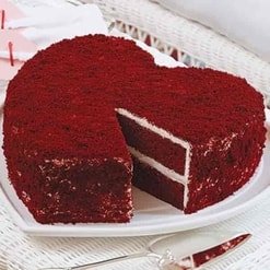 Red Velvet Cake featuring rich red layers and creamy white frosting, elegantly decorated for birthdays, weddings, or celebrations.