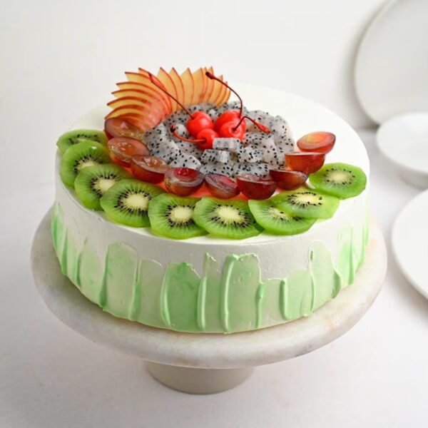 Fresh Fruit Green Cake featuring a moist green sponge layered with cream and topped with an assortment of colorful, fresh fruits.