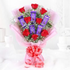 Love Red Roses & Dairy Milk Treats featuring a bouquet of fresh red roses paired with delightful Dairy Milk chocolates, ideal for romantic occasions.