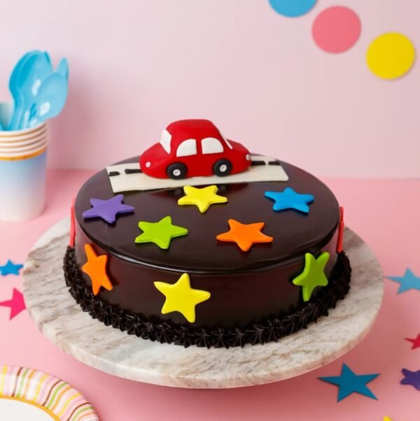 Race Car Adventure Cake featuring vibrant race car decorations and a checkered flag design, ideal for a fun and exciting children's birthday celebration.