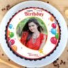 Round photo cake with personalized edible image, ideal for birthdays and special occasions.