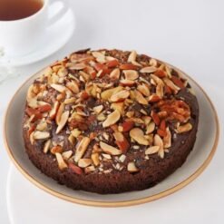 Almond Choco Bliss Cake featuring a moist chocolate base topped with creamy chocolate frosting and sprinkled with toasted almonds for added crunch.