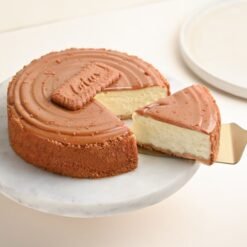 Rich and creamy Biscoff Indulgence Cheesecake topped with Biscoff cookie crumbs and a smooth Biscoff spread layer.