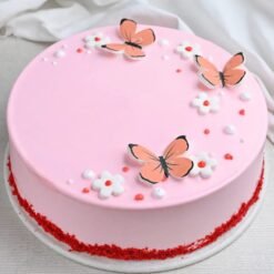 Elegant Velvet Butterfly Bloom Cake with soft layers and beautiful butterfly decorations, ideal for birthdays and special celebrations.