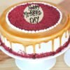 Cafe Cream Velvet Cake with layers of velvety cream and rich coffee flavor, elegantly decorated and served on a cake stand.