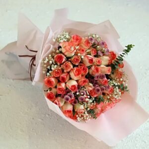 Charming Pink Roses And Daisies bouquet featuring vibrant pink daisies, ideal for gifts and bringing cheerful elegance to home or event decor.