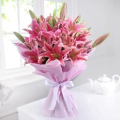 Charming Pink Lily Bouquet featuring a beautiful arrangement of pink lilies, ideal for gifts and enhancing home decor with elegance.