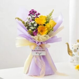 Cheerful Mom's Sunshine Bouquet featuring a lively arrangement of bright flowers, designed to celebrate and uplift mothers on any occasion.