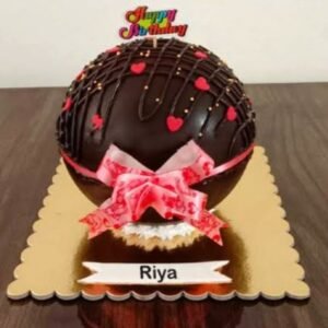 Choco Paradise Piñata Cake featuring a rich chocolate exterior that bursts open to reveal a colorful assortment of candies and treats inside.