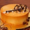 Coffee Dream Cake with rich coffee-flavored layers and creamy frosting, elegantly decorated with coffee beans and served on a cake stand.