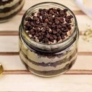 Decadent Chocolate Chip Cream Cake Jars with creamy layers and rich chocolate chips, perfect for indulgent dessert lovers.