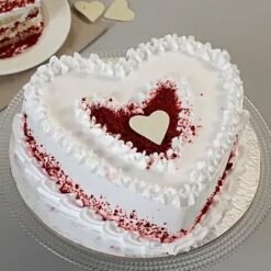 Delicious Red Velvet Heart Cake decorated with cream cheese frosting, ideal for expressing love and celebrating special moments with loved ones.