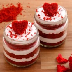 Heart Red Velvet Cake Jar Quartet showcasing layers of moist red velvet cake and creamy frosting, perfect for romantic occasions and dessert enthusiasts.