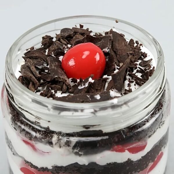 Blissful Black Forest Cake Jar Quartet with layers of rich chocolate cake, whipped cream, and cherries, perfect for dessert lovers.