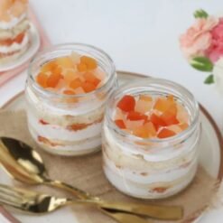 Fruit Fusion Jar Duo - Two dessert jars filled with layers of fresh fruit and cake, ideal for a sweet indulgence.