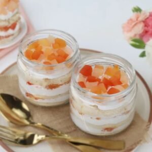 Fruit Fusion Jar Quad - A set of four jars filled with layers of fresh fruit and moist cake, ideal for dessert lovers.