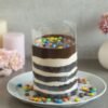 Gems Chocolate Pullup Cake with a cascading chocolate glaze and colorful candy gems, perfect for a fun and indulgent dessert.