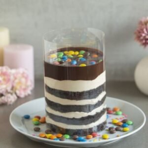 Gems Chocolate Pullup Cake with a cascading chocolate glaze and colorful candy gems, perfect for a fun and indulgent dessert.