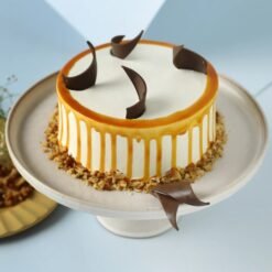 Golden Caramel Crunch Cake, beautifully layered with crunchy toppings and rich caramel, ideal for celebrations and special occasions with a sweet touch.