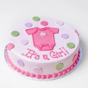 'It's A Girl' Baby Shower Cake beautifully decorated in pink and white, featuring adorable baby-themed designs to celebrate the upcoming arrival.