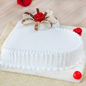 Heart-shaped vanilla cake with luxurious design, perfect for romantic celebrations and special occasions.