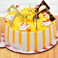 Mango Flavored Indulgence Cake with layers of moist mango sponge and creamy frosting, beautifully decorated for a tropical celebration.