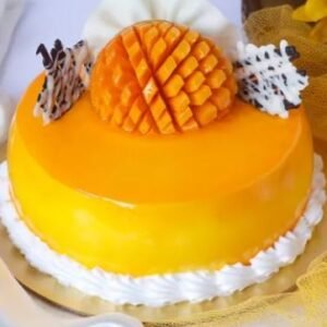 Mango Paradise Cake, featuring layers of moist cake and rich mango cream, beautifully decorated with fresh mango slices and tropical accents.