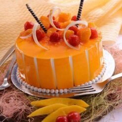 Mango Treasure Cake, featuring layers of moist cake infused with luscious mango flavor, decorated with fresh mango slices and vibrant toppings.