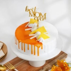 Mom’s Blissful Dream Cake with soft layers, creamy frosting, and beautiful floral decorations, perfect for Mother’s Day celebrations.