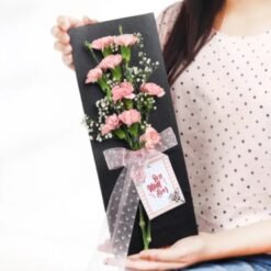 Mom's Carnation Tribute – a vibrant arrangement of colorful carnations designed to honor and celebrate mothers, perfect for any special occasion.